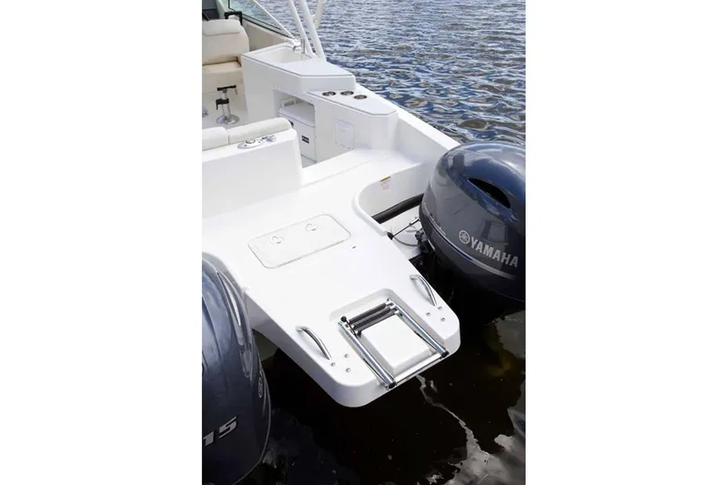 Slide: The Image of Manufacturer Provided Image: 2026 World Cat 230 SD boat with Yamaha engines and swim platform ladder. - 19
