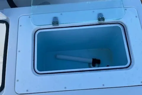 Slide: The Image of Open storage compartment on 2020 Parker 2501 Center Console boat. - 13