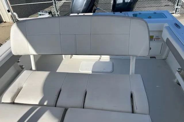 Slide: The Image of 2020 Parker 2501 Center Console boat interior with white cushioned seating. - 17