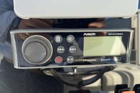Slide: The Image of Fusion MS-RA70NSX marine stereo on 2020 Parker 2501 Center Console boat dashboard. - 18