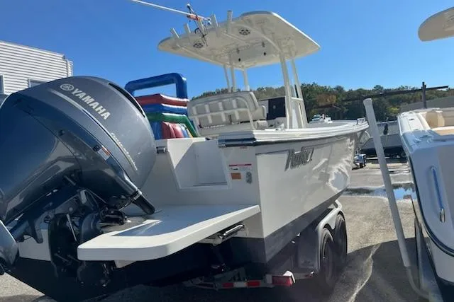 Slide: The Image of 2020 Parker 2501 Center Console boat with Yamaha engine, parked outdoors. - 3