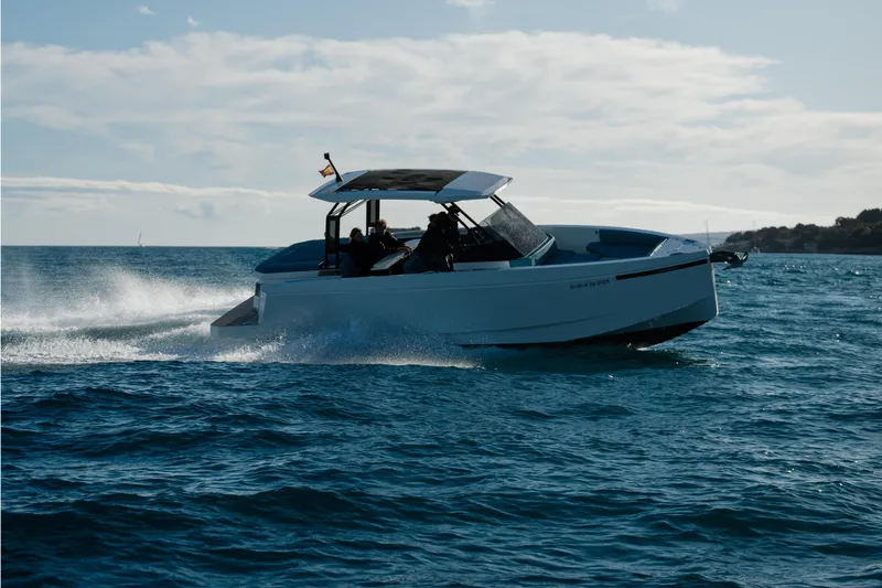 Slide: The Image of 2026 De Antonio Yachts D29 cruising on open water, creating dynamic waves. - 1