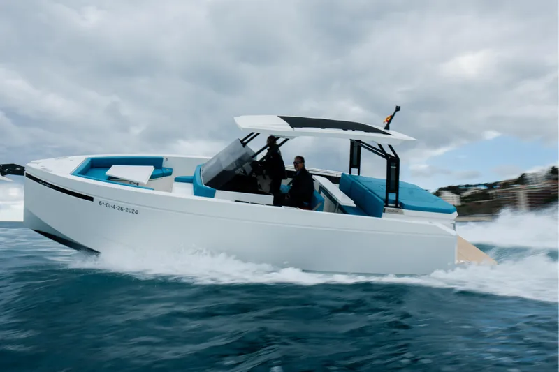 Slide: The Image of 2026 De Antonio Yachts D29 cruising on open water under clear skies. - 2