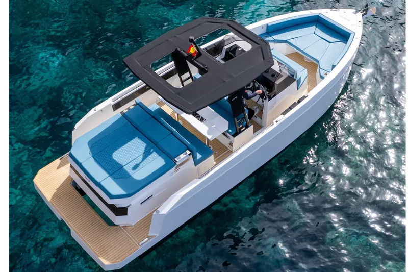 Slide: The Image of 2026 De Antonio Yachts D29 in a serene coastal cove, showcasing sleek design. - 4