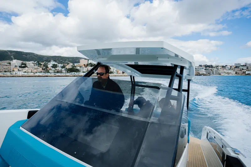 Slide: The Image of 2026 De Antonio Yachts D29 cruising on open water under a sunny sky. - 9