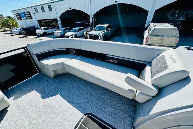 Slide: The Image of 2026 Harris Solstice DC 250 boat interior with spacious seating and modern design. - 10