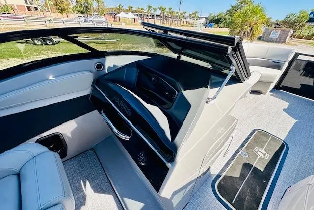 Slide: The Image of 2026 Harris Solstice DC 250 boat interior with sleek design and modern features. - 15