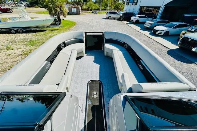 Slide: The Image of 2026 Harris Solstice DC 250 pontoon boat with spacious seating and modern design. - 17