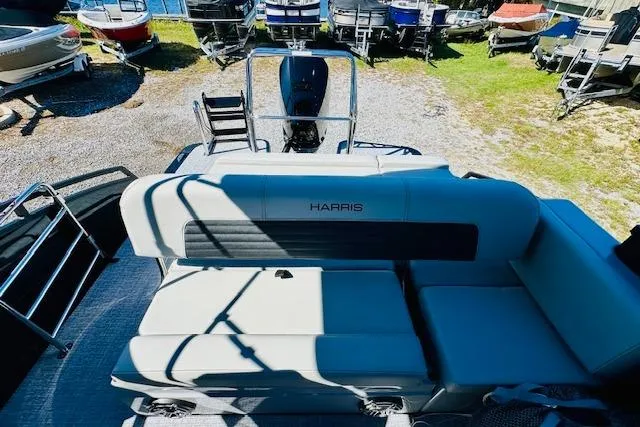 Slide: The Image of 2026 Harris Solstice DC 250 pontoon boat with spacious seating and modern design. - 18
