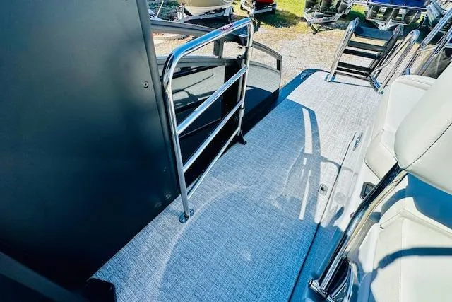Slide: The Image of 2026 Harris Solstice DC 250 boat deck with sleek railing and modern seating. - 20