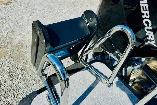 Slide: The Image of 2026 Harris Solstice DC 250 boat ladder and Mercury engine detail. - 23