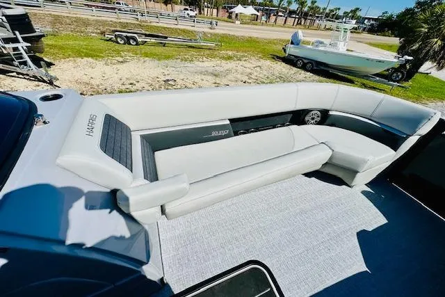 Slide: The Image of 2026 Harris Solstice DC 250 boat interior with spacious seating and modern design. - 9