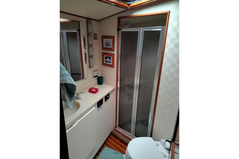 Slide: The Image of Bathroom interior of 1988 Viking 48 Convertible yacht with shower and sink. - 11