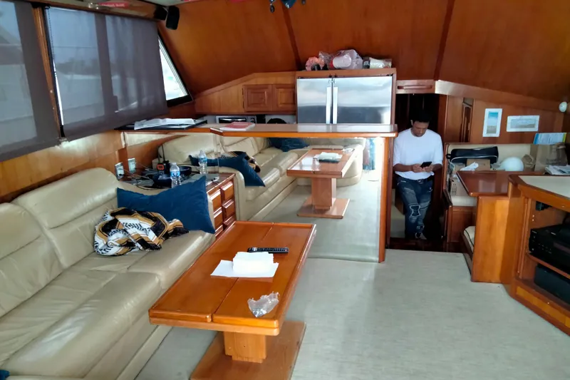 Slide: The Image of Luxurious interior of 1988 Viking 48 Convertible yacht with leather seating and wooden furnishings. - 13