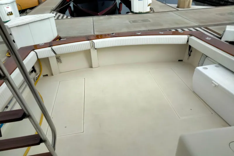 Slide: The Image of 1988 Viking 48 Convertible boat deck with seating and storage compartments. - 4