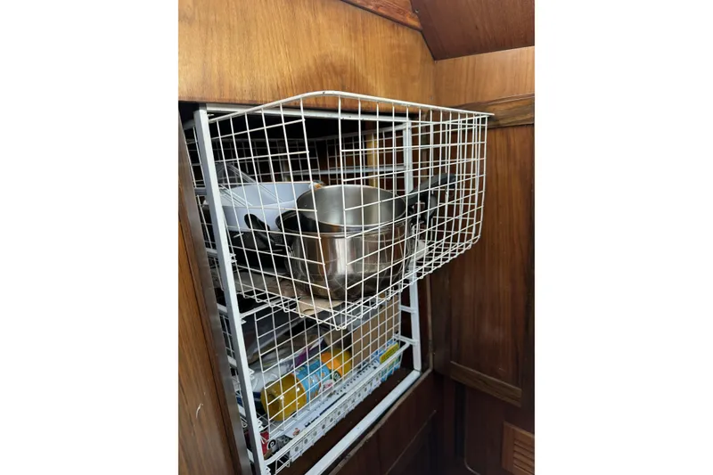 Slide: The Image of Wire basket storage in wooden cabinet on Barberis 38, 1984 model. - 11