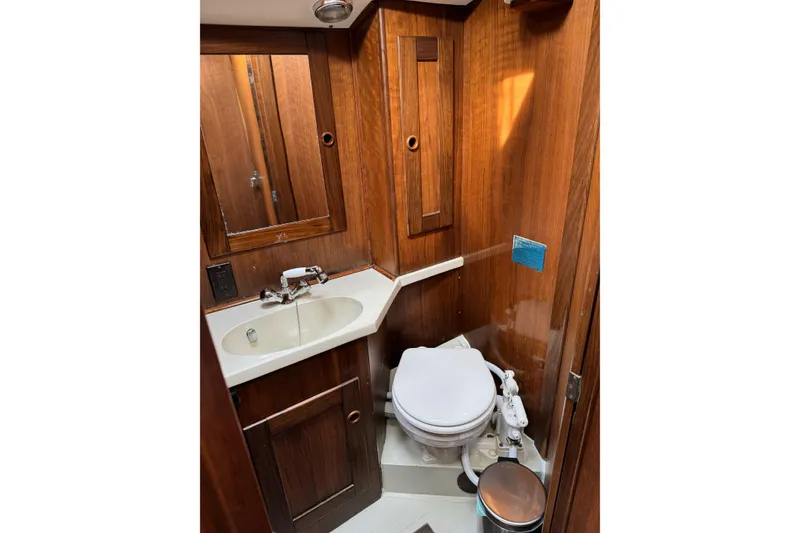 Slide: The Image of 1984 Barberis 38 yacht bathroom with wooden cabinetry and compact fixtures. - 19