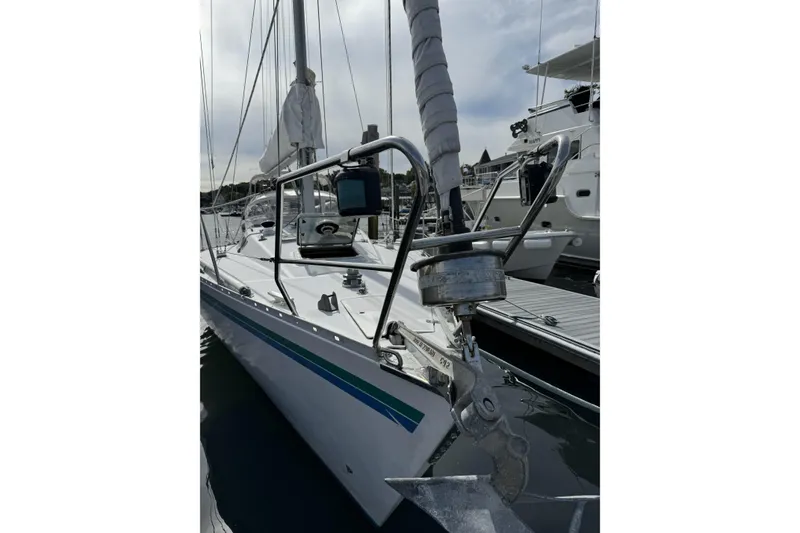 Slide: The Image of 1984 Barberis 38 sailboat docked, featuring sleek design and polished metalwork. - 2