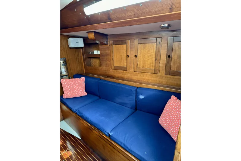 Slide: The Image of Cozy Barberis 38 yacht interior with blue cushions and wooden cabinets, 1984 model. - 20