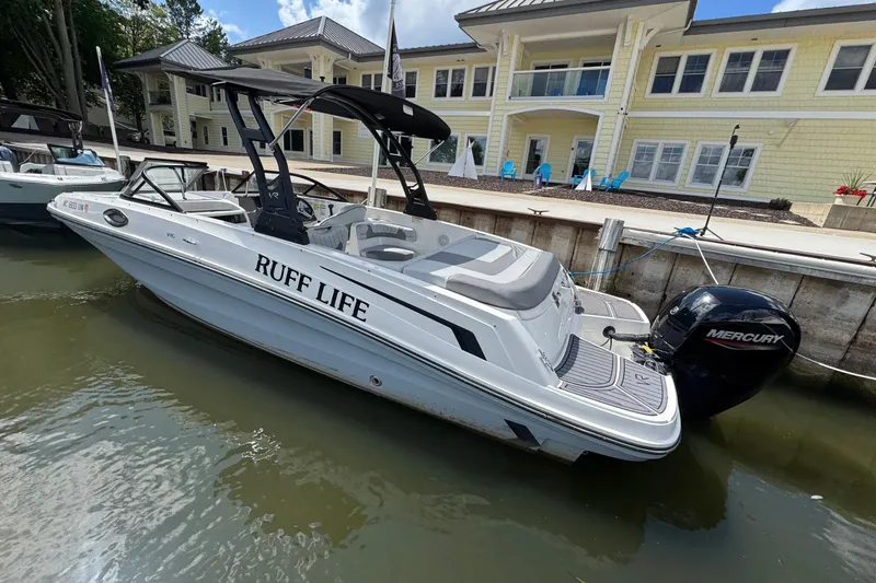 The Image of 2023 Bayliner VR6 Bowrider OB docked, featuring "Ruff Life" text and Mercury outboard engine. - 1