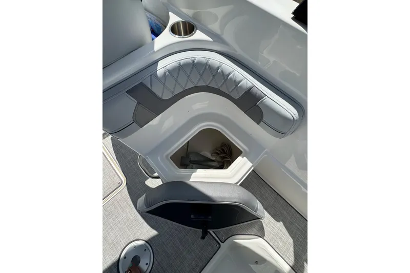 Slide: The Image of 2023 Bayliner VR6 Bowrider OB interior with storage compartment and seating detail. - 22
