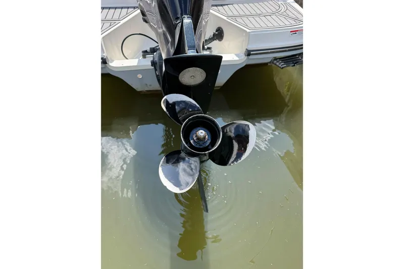 Slide: The Image of 2023 Bayliner VR6 Bowrider OB outboard motor propeller in water. - 30