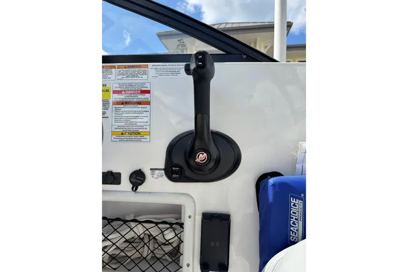 Slide: The Image of 2023 Bayliner VR6 Bowrider OB throttle control with safety warnings and accessories. - 8