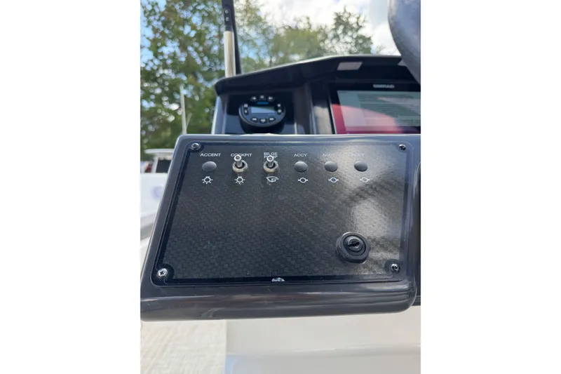 Slide: The Image of Control panel of 2023 Bayliner VR6 Bowrider OB boat with switches and buttons. - 9