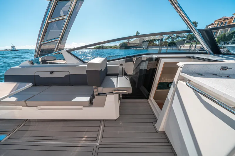 Slide: The Image of Aquila 32 Sport 2022 yacht interior with sleek seating and ocean view. - 18