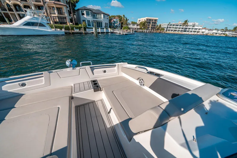 Slide: The Image of Aquila 32 Sport 2022 boat interior with waterfront view, luxurious seating, and modern design. - 34
