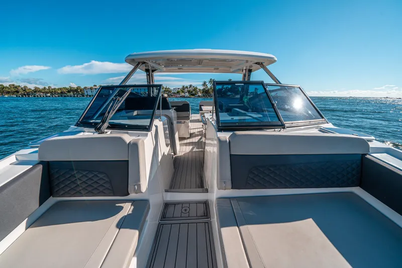 Slide: The Image of Aquila 32 Sport 2022 boat interior with seating, on a sunny day at sea. - 35
