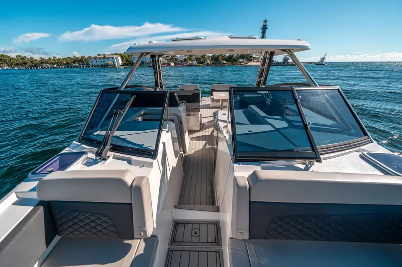 Slide: The Image of Aquila 32 Sport 2022 boat on water, featuring sleek design and spacious seating. - 36