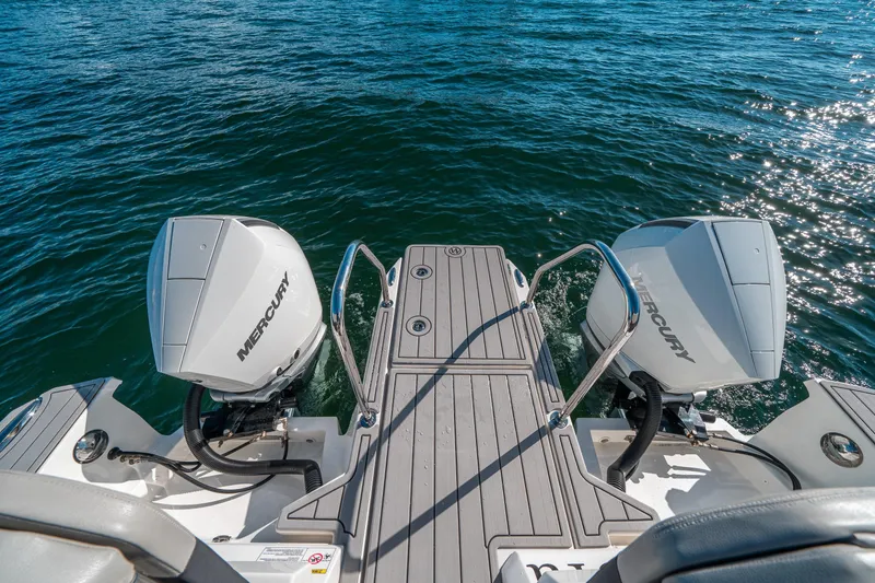 Slide: The Image of Aquila 32 Sport 2022 boat with dual Mercury outboard engines on water. - 8