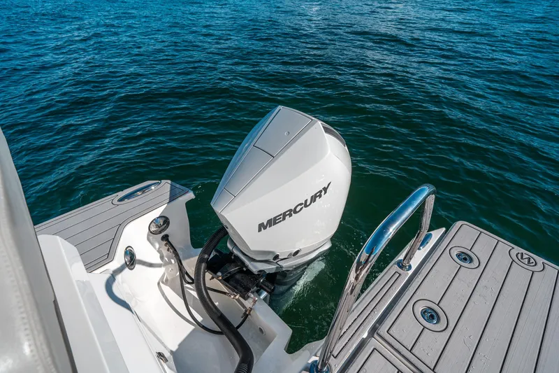 Slide: The Image of Aquila 32 Sport 2022 boat with Mercury outboard motor on water. - 9