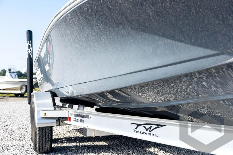 Slide: The Image of 2026 Tidewater 2110 Bay Max boat on trailer, close-up view. - 12