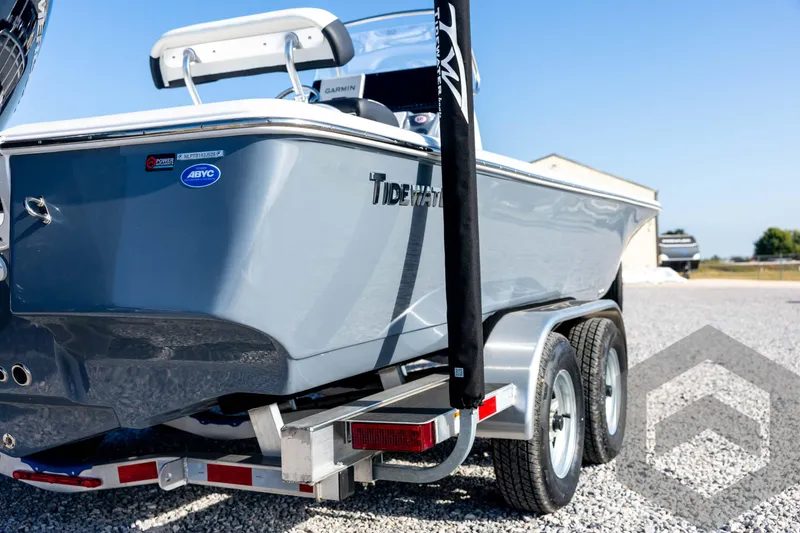 Slide: The Image of 2026 Tidewater 2110 Bay Max boat on a trailer, parked on gravel. - 15