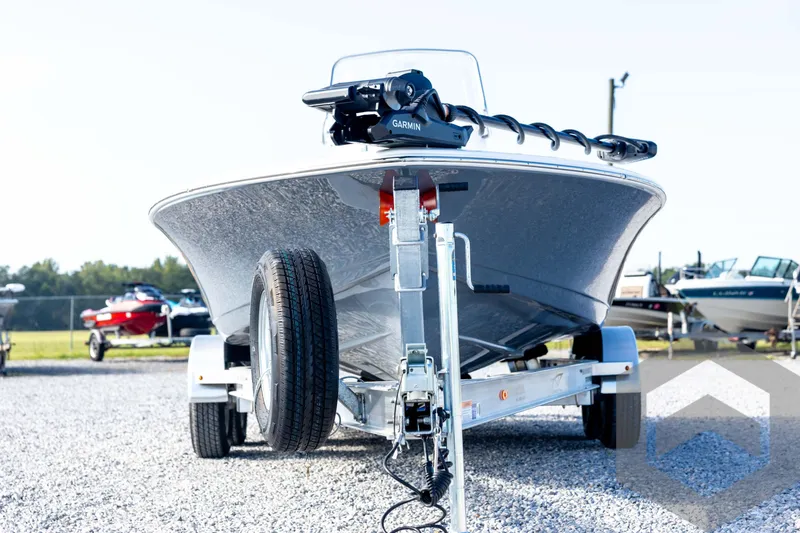 Slide: The Image of 2026 Tidewater 2110 Bay Max boat on trailer in outdoor setting. - 2