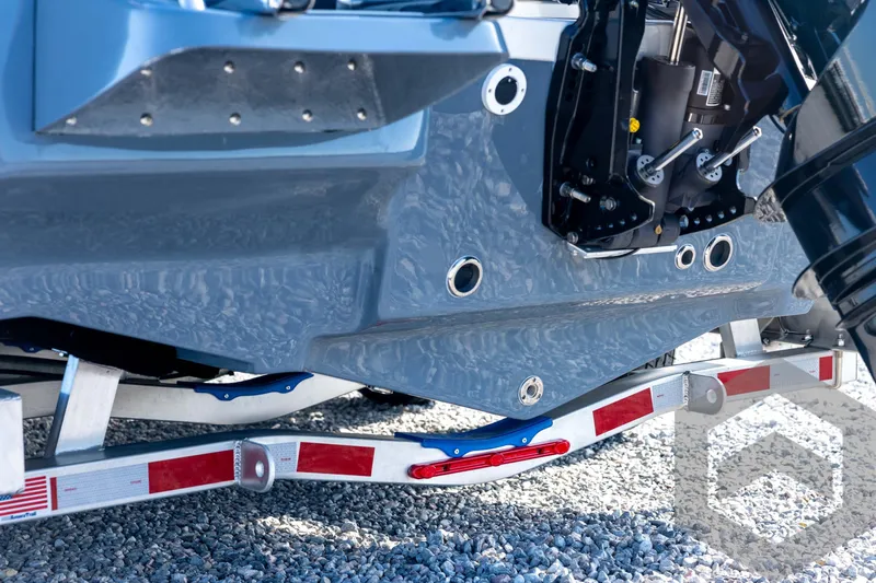 Slide: The Image of 2026 Tidewater 2110 Bay Max boat hull and trailer close-up. - 21