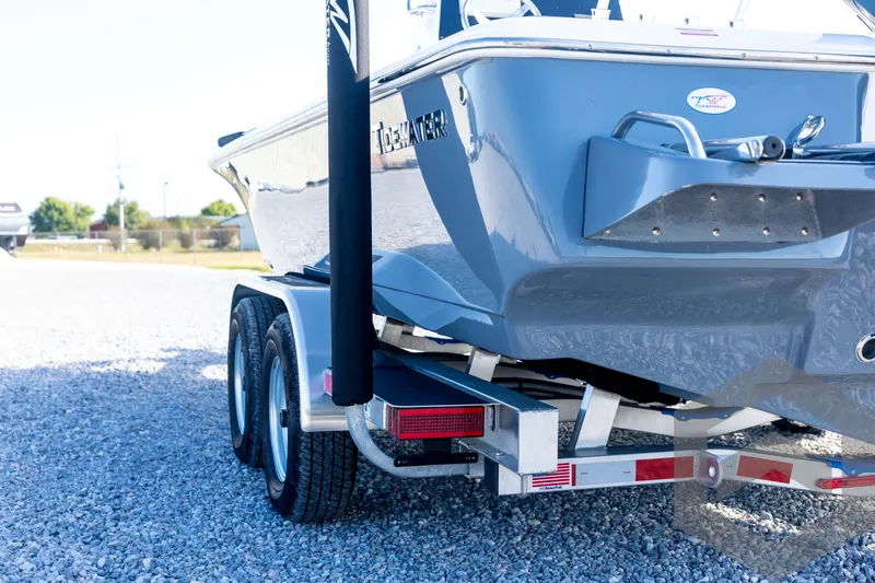Slide: The Image of 2026 Tidewater 2110 Bay Max boat on trailer, parked on gravel. - 22