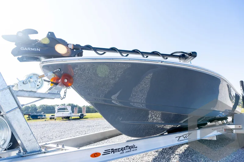 Slide: The Image of 2026 Tidewater 2110 Bay Max boat on trailer with Garmin equipment, outdoor setting. - 28