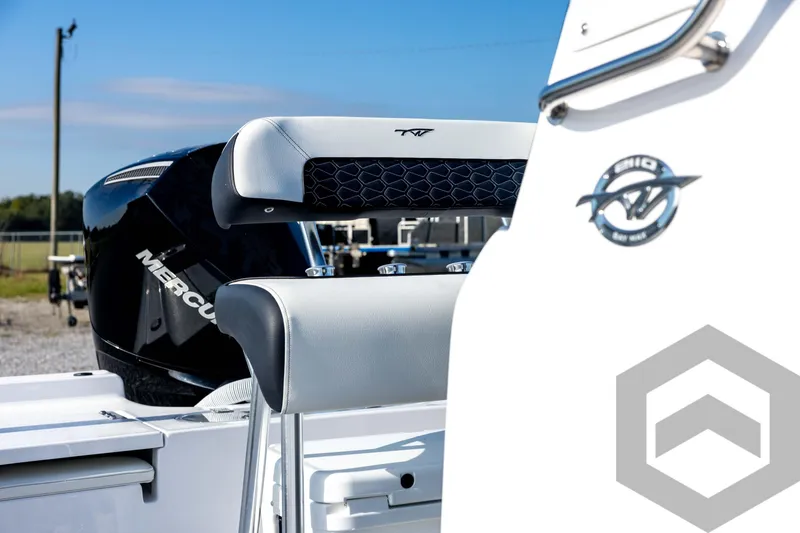 Slide: The Image of 2026 Tidewater 2110 Bay Max boat with Mercury engine, featuring sleek seating and modern design. - 31