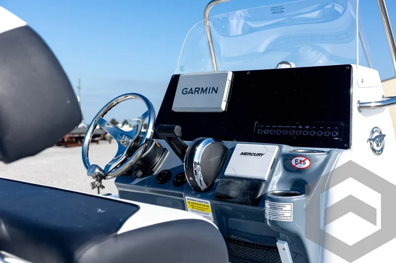 Slide: The Image of 2026 Tidewater 2110 Bay Max boat console with Garmin and Mercury controls. - 33
