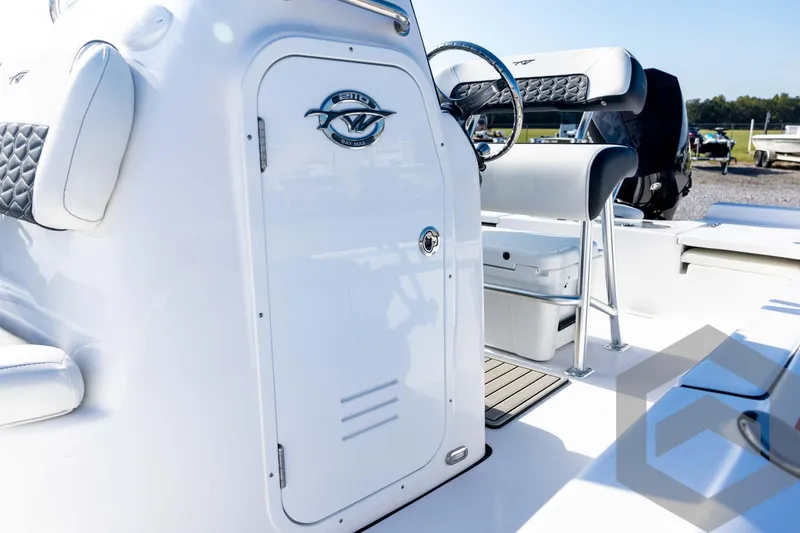 Slide: The Image of 2026 Tidewater 2110 Bay Max boat interior with steering wheel and seating. - 35