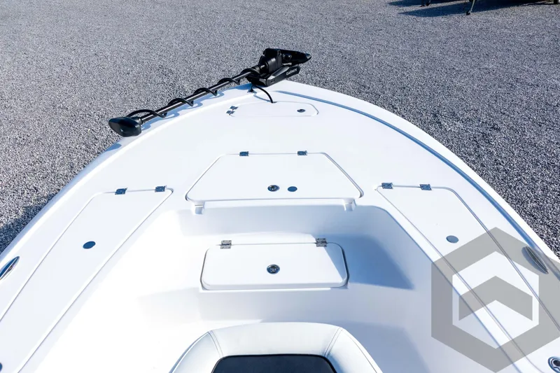 Slide: The Image of 2026 Tidewater 2110 Bay Max boat deck with storage compartments and trolling motor. - 36