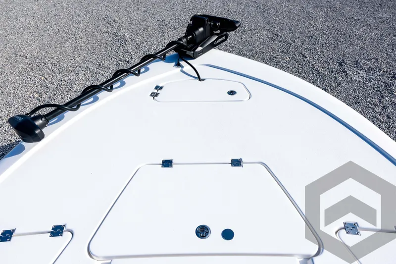 Slide: The Image of 2026 Tidewater 2110 Bay Max boat deck with Garmin trolling motor, on gravel surface. - 37