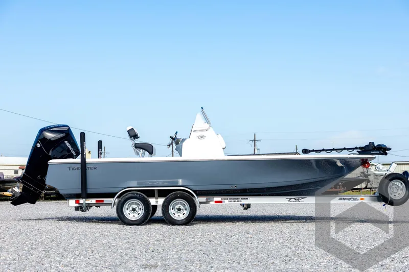 Slide: The Image of 2026 Tidewater 2110 Bay Max boat on trailer, side view, clear sky background. - 4