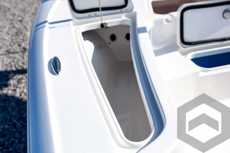 Slide: The Image of 2026 Tidewater 2110 Bay Max boat storage compartment, open and empty, on a sunny day. - 40