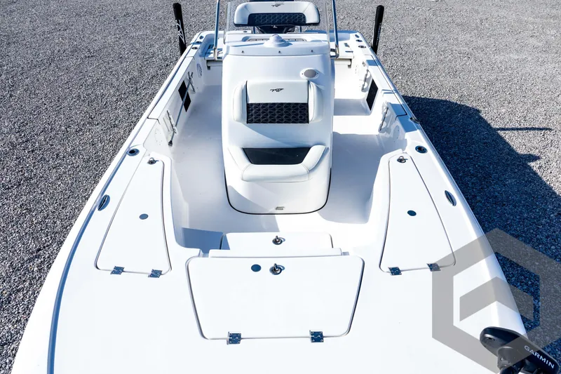 Slide: The Image of 2026 Tidewater 2110 Bay Max boat interior with white seating and storage compartments. - 44