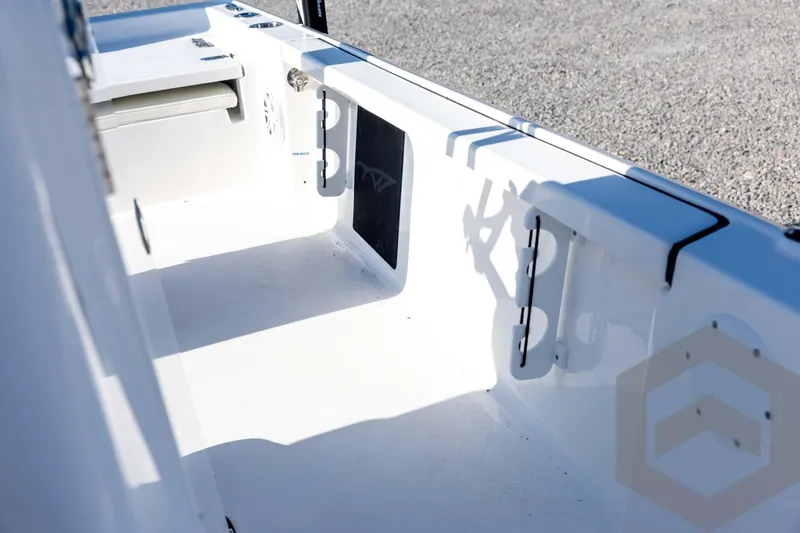 Slide: The Image of 2026 Tidewater 2110 Bay Max boat interior with storage compartments and seating. - 47
