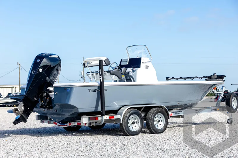 Slide: The Image of 2026 Tidewater 2110 Bay Max boat on trailer, featuring sleek design and powerful outboard motor. - 5